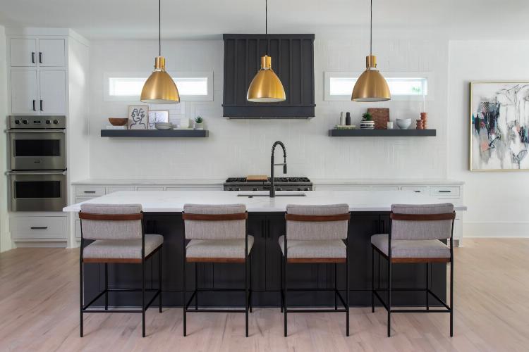 Stylish gold pendant lights over kitchen island